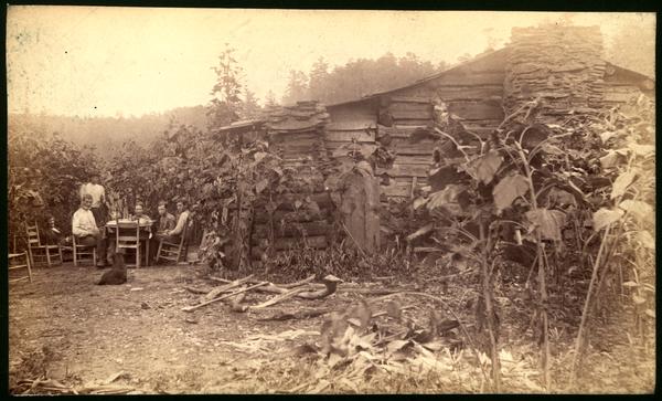 A.J. Dorsey's cabin. Family at breakfast